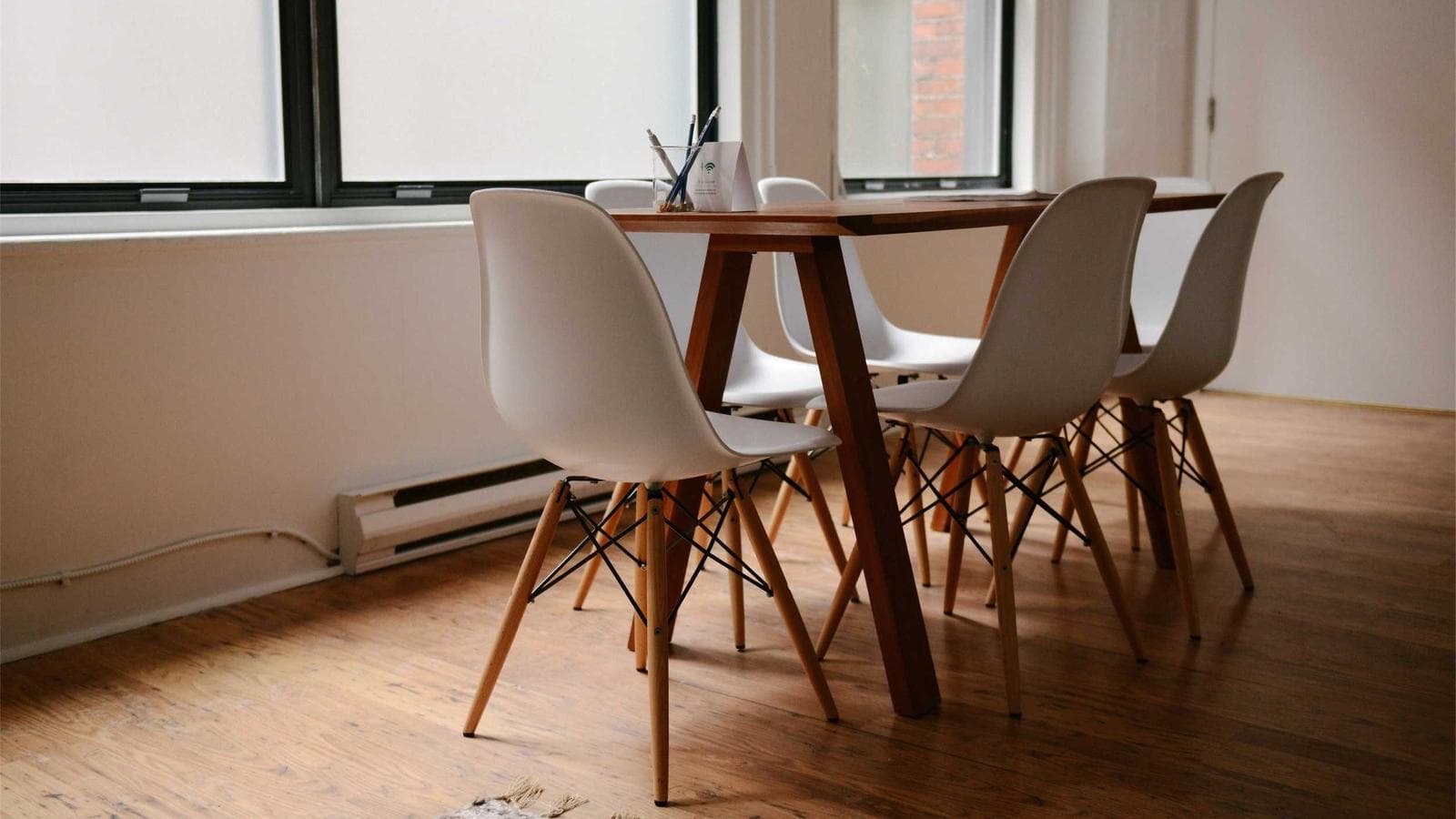 A furnished dining room in a managed rental